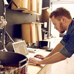 Photo of a man working in his office